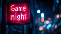 Glowing red neon game night sign against dark urban background with blurred blue bokeh lights creating moody nighttime atmosphere for entertainment venues.