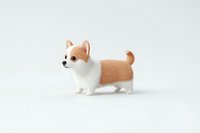 Adorable Corgi puppy figurine with tan and white fur standing on white background, isolated miniature toy model for collectors and decorative purposes.