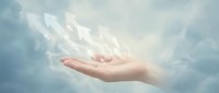 Open hand releasing glowing white doves into cloudy sky symbolizing peace, freedom, hope and spiritual liberation concept for meditation designs.