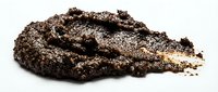 Pile of brown soil or earth isolated on white background, suitable for gardening, landscaping, and agricultural design projects.