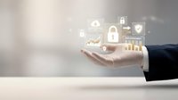 Business hand displaying digital security icons with padlock shield and warning symbols for cybersecurity data protection and network safety concepts.