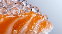 Fresh orange citrus segment with pure water drops and bubbles creating natural macro texture. Juicy fruit close up for healthy lifestyle concept.