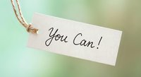 Motivational paper tag with You Can handwritten message and natural twine string on soft green background for inspiration and encouragement projects.