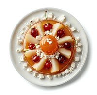 Elegant dessert with caramel flan garnished with fresh cherries and meringue pieces on white plate, viewed from above in natural lighting.