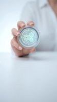 Professional hand holding glowing digital gear mechanism sphere representing automation, innovation and technological solutions for business processes.