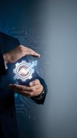 Businessman hands protecting glowing gear with upward arrow symbol representing business growth, innovation and strategic development concepts.