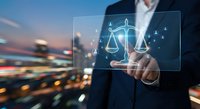 Businessman touching digital justice scales interface with network connections over blurred city lights background representing legal technology solutions.