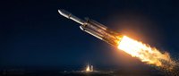 Heavy-lift launch vehicle with powerful engines igniting at night, producing bright flame and exhaust plume against dark sky, suitable for aerospace and space exploration content.