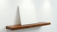 Minimalist wooden floating shelf with white canvas frame against clean wall for modern home decor and interior design projects.