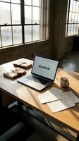 Startup workspace with laptop, handwritten notes, leather journals, and coffee mug on wooden desk in sunlit loft office.
