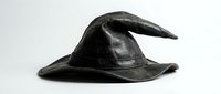 Black leather wizard hat with curved brim isolated on white background for Halloween costume design and fantasy themed projects.