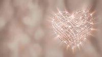Glowing heart-shaped string lights with warm white LED bulbs creating romantic ambiance on soft blurred background for love celebrations and decor.