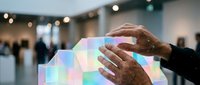 Hands interacting with holographic digital interface displaying colorful data visualization in modern tech environment for business presentations.
