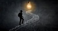 Businessman climbing illuminated staircase toward glowing lightbulb representing career growth, success journey and innovative thinking in dark space.