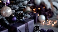 Purple wrapped gift box with silver ribbon near decorated Christmas tree with pinecones, silver baubles and bokeh lights creating magical holiday atmosphere.