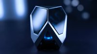 Futuristic metallic helmet with glowing blue visor and angular design on dark background with bokeh lights, suitable for sci-fi, gaming, and technology concepts.