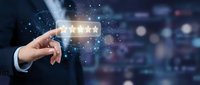 Hand holding glowing five-star rating icon with digital particles and blurred cityscape background. Represents customer satisfaction, feedback, and online reviews for business and technology.