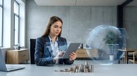 Professional businesswoman analyzing global financial data on tablet with holographic earth projection in modern office environment for corporate presentations.