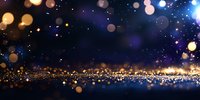 Abstract glowing golden and blue bokeh lights on dark background with sparkles and reflective surface creating magical festive atmosphere.