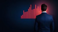 Caucasian businessman in navy suit looking at glowing red financial chart graph on dark background, rear view showing market analysis and growth trends.