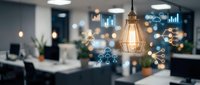 Modern office workspace with digital network icons and pendant lighting showcasing connectivity and smart technology integration in corporate environment.
