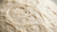 Cooked rice noodles with shallow depth of field, close-up food photography for culinary, restaurant, and Asian cuisine content.