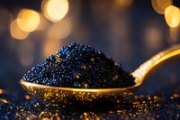 Black caviar on golden spoon with luxurious bokeh lights background, premium seafood delicacy close-up macro shot highlighting texture and shine of sturgeon roe.