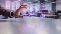 Business professional protecting API data integration with holographic cloud computing interface displaying connectivity and data flow management systems.