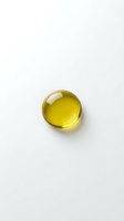 Golden yellow gel capsule supplement pill isolated on white background for health and wellness design projects.