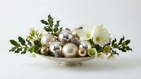 Elegant Christmas centerpiece with gold and silver ornaments, white flowers and holly leaves arranged in decorative bowl for holiday table decor.