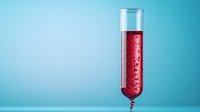 Red sparkling liquid in tall glass test tube with bubbles against turquoise background, modern minimalist composition for science and laboratory concepts.