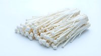 Bunch of wooden toothpicks with round heads isolated on white background, ready for design use in packaging, culinary, and dental hygiene projects.