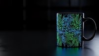 Black coffee mug with vibrant green and blue circuit board pattern design on dark surface with copy space for technology branding and promotional materials.