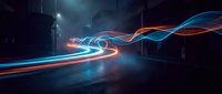 Neon light trails curve through dark urban street at night, creating glowing blue and orange waves of motion and energy in modern city environment.