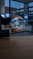 Businessman hands protecting holographic network diagram with connected nodes in modern office environment for digital transformation and innovation concepts.