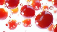 Red liquid drops and bubbles floating in bright light creating abstract fluid motion with glossy spheres and transparent elements for modern design projects.