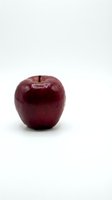 Fresh red apple isolated on white background for healthy eating and nutrition concepts.