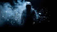 Mysterious hooded figure in dark environment with glowing digital particles and atmospheric smoke effects for cybersecurity and technology concepts.