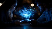 Young couple using smartphones with glowing blue digital cloud connecting their devices in dark room, representing modern communication and data sharing technology.