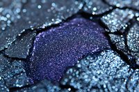 Shimmering purple and silver glittery eyeshadow powder with sparkling texture for makeup and cosmetic applications.