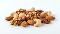 Mixed nuts collection with almonds cashews walnuts and pecans on white background for healthy snacking and cooking recipes.