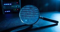 Magnifying glass reveals binary code on digital screen, cybersecurity analysis and data investigation concept for technology research and forensic examination.