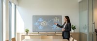 Professional businesswoman presenting cloud computing data analytics on large screen in modern bright office conference room for corporate training.
