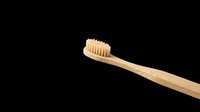 Wooden toothbrush with natural bristles isolated on transparent background, ready for clipart, t-shirt design, print-on-demand products, stickers, and sublimation projects.