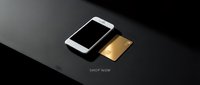 Smartphone and gold credit card on dark surface with shop now text, online shopping and digital payment concept.