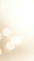 Soft beige bokeh background with warm light circles creating dreamy atmosphere for presentations and design projects.