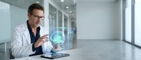 Middle-aged Caucasian male doctor in white coat using tablet with holographic brain projection in modern medical facility for neurology research and diagnosis.