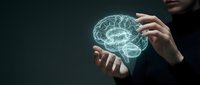 Businessman holding glowing digital brain hologram representing artificial intelligence, machine learning, and innovative technology solutions for modern business.