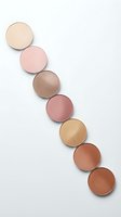 Makeup foundation powder compacts in various skin tone shades arranged diagonally on white background for beauty and cosmetics branding.