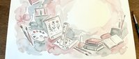 Watercolor art supplies and creative tools scattered on workspace with paintbrushes, palette, sketchbooks and artistic materials for creative projects.